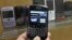 A BlackBerry device is shown in front of products displayed in a glass cabinet at the Research in Motion offices in Waterloo November 14, 2012.