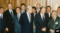 Foreign ministers attending the Paris Peace Conference on Cambodia pose prior to the meeting, Oct. 23, 1991. Front row L-R: United Nations Secretary General Javier Perez de Cuellar, Roland Dumas of France, Cambodia's Prince Norodom Sihanouk, back row L-R: unidentified, U.S. Secretary of State James Baker, Qian Qichen of China, Soviet Union's Boris Pankin, Burnei's Prince Mohamed Bolkiah, Great Britain's Lord Caithness, unidentified, Thailand's Anan Sarasin. (AP Photo)