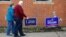 A couple arrive at a polling place in Carnegie, Pennsylvania, March 13, 2018. 