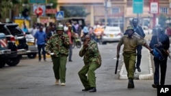 Kenyan police fire tear gas grenades at supporters of opposition leader Raila Odinga as they attempt to demonstrate in downtown Nairobi, Kenya, Oct. 24, 2017. 