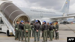 This handout picture released by the Colombian Aerospace Force press office shows a Boeing 737-700 aircraft before preparing to take off to San Diego, California, to bring back people deported by the U.S., at the Military Air Transport Command CATAM in Bogota on Jan. 27, 2025.