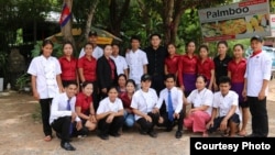 Luon Anchamnes with his employees in front of his Palmboo restaurant in Siem Reap. (Courtesy Photo)