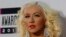 Musician Christina Aguilera arrives at the 41st American Music Awards in Los Angeles, California, Nov. 24, 2013.