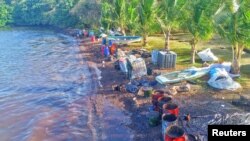 A drone image shows materials prepared by volunteers to handle leaked oil from the bulk carrier ship MV Wakashio, belonging to a Japanese company, which ran aground on a reef, at the Riviere des Creoles, Mauritius, Aug. 10, 2020.