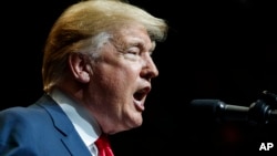 U.S. President Donald Trump speaks at the North Side Gymnasium in Elkhart, Ind., Thursday, May 10, 2018, during a campaign rally.