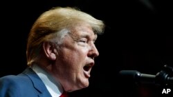 U.S. President Donald Trump speaks at the North Side Gymnasium in Elkhart, Ind., Thursday, May 10, 2018, during a campaign rally.