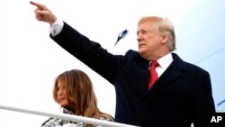 President Donald Trump and first lady Melania Trump board Air Force One at Andrews Air Force Base, Md., en route to Paris, Nov. 9, 2018, where they will participate in World War I commemorations.