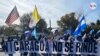 Miembros de la diáspora nicaragüense en Washington marchan desde la OEA hasta la embajada de Nicaragua en Washington D.C., el día de la elecciones presidenciales en el país centroamericano, el 7 de noviembre de, 2021.