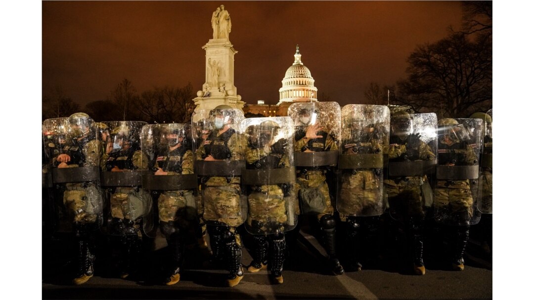 District of Columbia National Guardsmen stand outside the Capitol on Jan. 6, 2021, after a day of rioting Trump supporters.