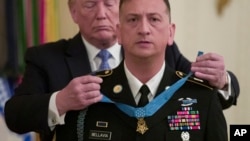 President Donald Trump awards the Medal of Honor to Army Staff Sgt. David Bellavia in the East Room of the White House in Washington, June 25, 2019, for conspicuous gallantry.