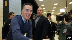 Republican presidential candidate Mitt Romney greets supporters at a caucus, in Portland, Maine, February 11, 2012.