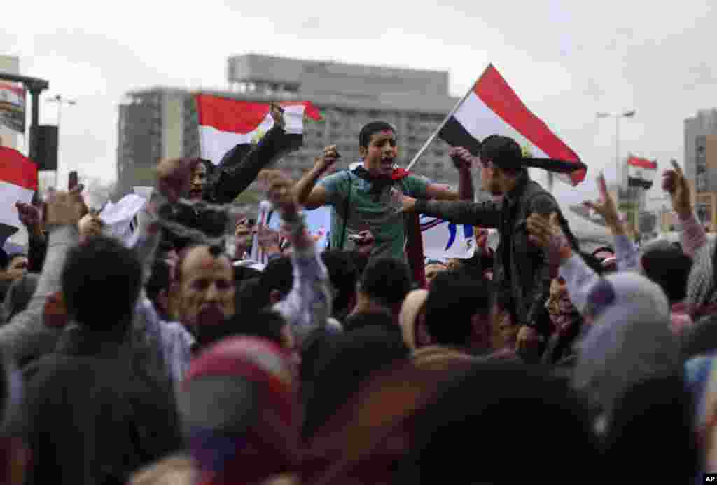 Egyptian protesters chant anti-government slogans during a rally in Tahrir Square, Cairo, February 1, 2013.