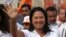 Presidential candidate Keiko Fujimori, of the "Fuerza Popular" political party, waves to supporters as she campaigns in San Juan de Lurigancho shantytown on the outskirts of Lima, Peru, March 22, 2016.