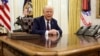 FILE PHOTO: U.S. President Trump signs an executive order in the Oval Office, at the White House