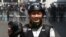 This picture taken on February 26, 2021 shows Associated Press (AP) photographer Thein Zaw posing for a photo during his coverage of demonstrations by protesters against the military coup in Yangon, a day before he was arrested. (Photo by STR / AFP)