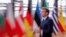 France's President Emmanuel Macron speaks to the press as he arrives prior to an EU summit in Brussels, on October 15, 2020.