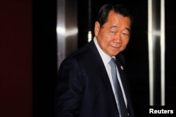 FILE - Dhanin Chearavanont, chairman of Thailand's largest agribusiness group, Charoen Pokphand Food, arrives at a Thailand-China Business Council Seminar in Bangkok, March 15, 2013.