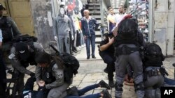 Israeli police arrests a Palestinian during a protest demanding a release of Heba al-Labadi, a Jordanian citizen of Palestinian descent, in east Jerusalem, Oct. 26, 2019.