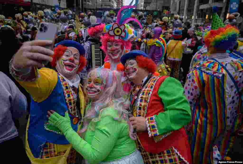 People in fancy clothing take part in the yearly Mummers Parade in Philadelphia, Pennsylvania, Jan. 2, 2022.