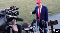 President Donald Trump speaks to reporters before departing on the South Lawn of the White House in Washington, Feb. 28, 2025.