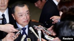 Japan's newly-appointed Economy, Trade and Industry Minister Yoichi Miyazawa speaks to the media after visiting Japan's Prime Minister Shinzo Abe at his official residence in Tokyo, October 20, 2014.