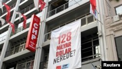 A banner reading "Where is the $128 billion?" hangs at the Beyoglu district office of main the opposition Republican People's Party (CHP) in Istanbul, Turkey, April 13, 2021.