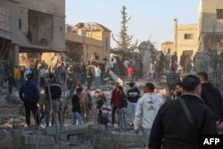 Rescuers gather at the site of an Israeli airstrike that targeted a house in the eastern Lebanese city of Baalbek on Nov. 14, 2024.