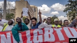 FILE - Demonstrators from different religious organisations and faiths chant slogans and hold placards against homosexuality while marching towards the Kenyan Parliament in downtown Nairobi on October 6, 2023.