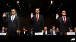 FILE - From left, Facebook's General Counsel Colin Stretch, Twitter's Acting General Counsel Sean Edgett, and Google's Senior Vice President and General Counsel Kent Walker, are sworn in for a Senate Intelligence Committee hearing on Russian election activity and technology, on Capitol Hill in Washington, Nov. 1, 2017. There were signs, some say telltale signs, of Russians using social media to meddle in the U.S. elections long before tech companies wised up to it. Could Facebook, Google and Twitter have caught the abuse earlier? 