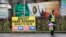 A man walks past republican posters referring to Brexit in West Belfast, Northern Ireland, Feb. 28, 2017. 