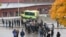 A crowd gathers outside, as emergency services attend the scene of a sword attack by a masked man at the Kronan school in Trollhattan, Sweden, Oct. 22, 2015. At least six people were injured, and the offender was shot by the police. 