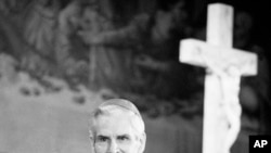 FILE - Bishop Fulton J. Sheen appears before parishioners on Good Friday at New York's St. Agnes Roman Catholic Church, April 13, 1979.