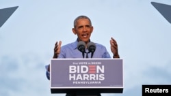 Former U.S. President Barack Obama gestures as he campaigns on behalf of Democratic presidential nominee and his former Vice President Joe Biden in Philadelphia, Pennsylvania, Oct. 21, 2020.