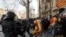 Catalan police officers clash with demonstrators outside a subway after blocking a train rail, during a general strike in Catalonia, Spain, Feb. 21, 2019. 