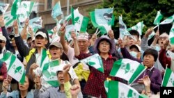 Pro-independence demonstrators shout slogans during a rally in Taipei, Taiwan, Oct. 20, 2018. 