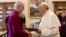 Pope Francis exchanges gifts with the Archbishop of Canterbury, Justin Welby, during a private audience at the Vatican on June 14, 2013.