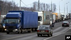 FILE - Long-haul truck drivers converge about 30 kilometers south of Moscow, Russia, Dec. 3, 2015. The drivers were protesting a proposed new road tax for long-distance haulers. Long-distance truck drivers across Russia have begun a new series of protests against a national highway toll system that was implemented last year. 