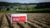 A sign for the No! campaign is seen in a field ahead of a national biodiversity referendum, in Hoechstetten, Switzerland, Aug. 23, 2024.