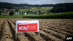 A sign for the No! campaign is seen in a field ahead of a national biodiversity referendum, in Hoechstetten, Switzerland, Aug. 23, 2024.