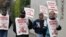 A small group of picketers from Bakery and Confectioners Workers Union Local 9 walk past a closed Hostess plant, Seattle, Nov. 16, 2012.