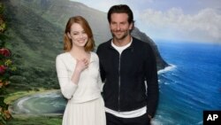U.S actress Emma Stone and U.S actor Bradley Cooper pose for photographers at a photocall for Aloha at a central London venue, May 16, 2015.