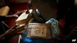 Bags of confiscated cocaine are shown at the office of the Guinean drug enforcement agency in Conakry, Guinea. (FILE)