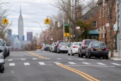 The Empire State building is seen in the distance from an empty street, April 2, 2020, in the Brooklyn borough of New York.