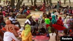 Cameroonians who fled deadly intercommunal violence in between Arab Choa herders and Mousgoum and Massa farming communities are seen at a temporary refugee camp in Farcha district, N'djamena, Chad, Dec. 9, 2021. 