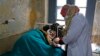 FILE - An elderly Kashmiri tuberculosis patient receives treatment at the Chest Disease Hospital on World Tuberculosis Day in Srinagar, India, March 24, 2015.