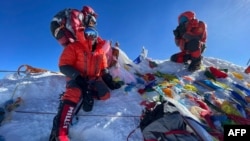 This photo taken May 31, 2021, shows mountaineers at the summit of Mount Everest, in Nepal. (Lakpa Sherpa)