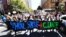 School students march up King William Street after attending the global #ClimateStrike rally at South Australia's Parliament House in Adelaide, Australia, March 15, 2019. 