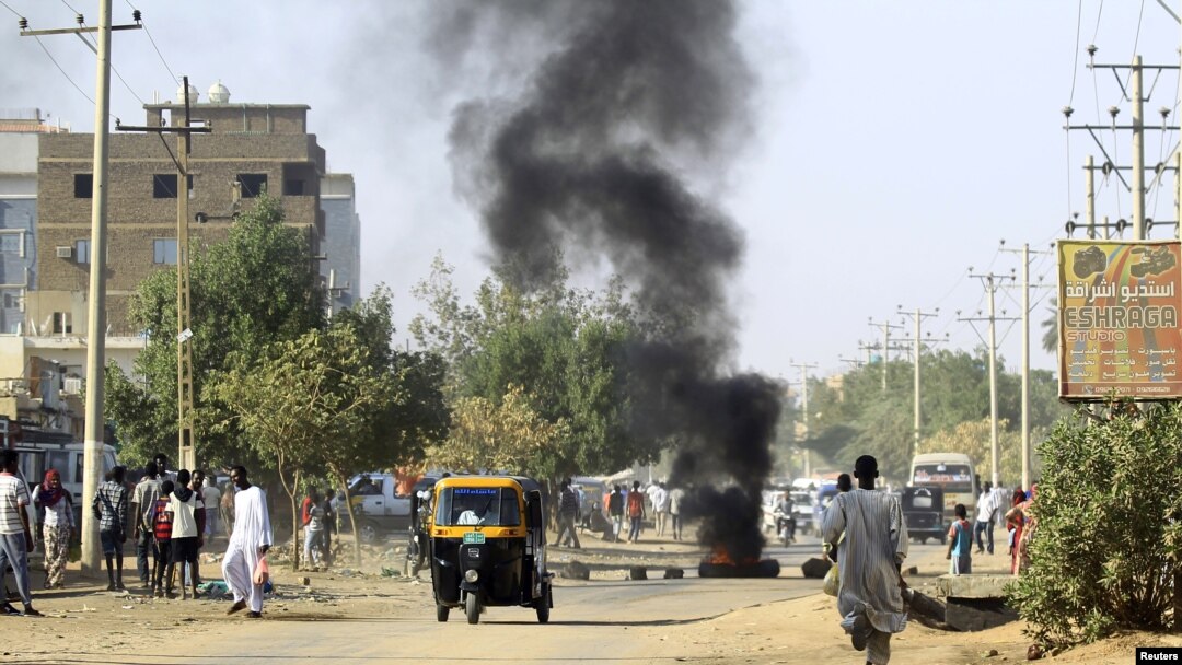 A tire is seen burning during anti-government protests in Khartoum, Sudan, Jan. 24, 2019. 
