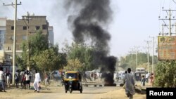 A tire is seen burning during anti-government protests in Khartoum, Sudan, Jan. 24, 2019. 