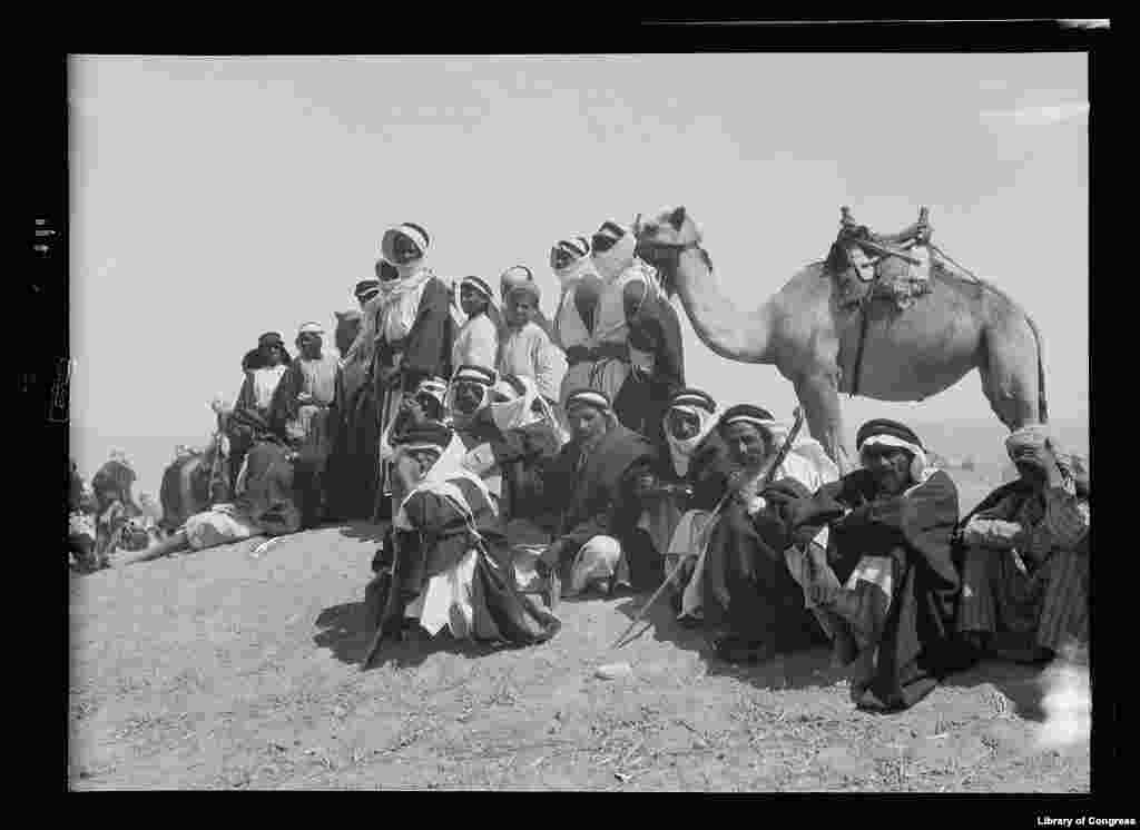 Bedouins watching camel races at celebrating marking end of locust campaign, June 30, 1930 